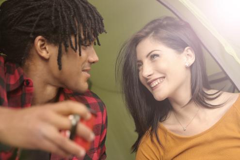 man and woman smiling and talking to each other